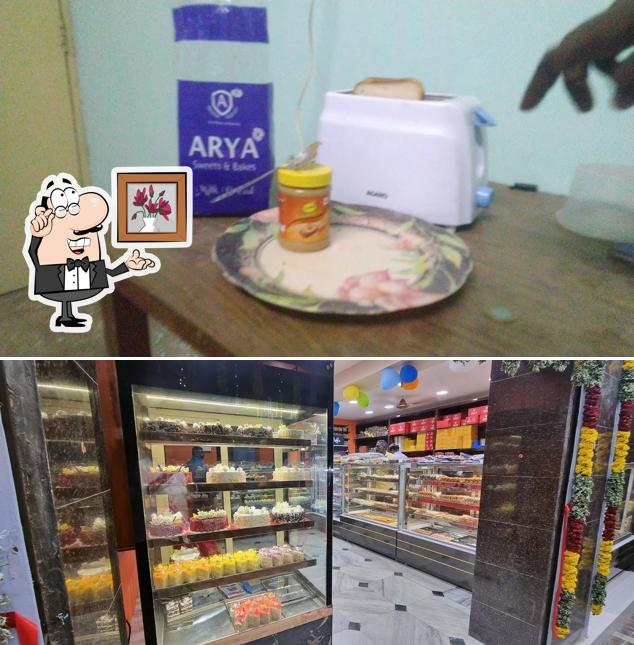 Take a seat at one of the tables at Arya Sweets and Bakes