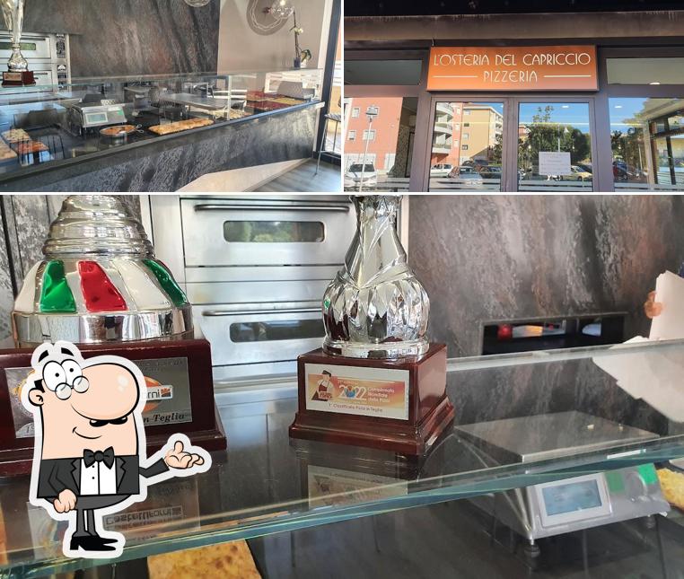 Guarda la immagine che presenta la interni e esterno di L'OSTERIA DEL CAPRICCIO PIZZERIA