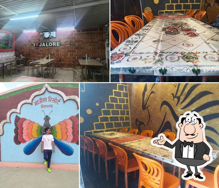 Take a seat at one of the tables at Al Jilani Sahi Jayka Non Veg Restorent