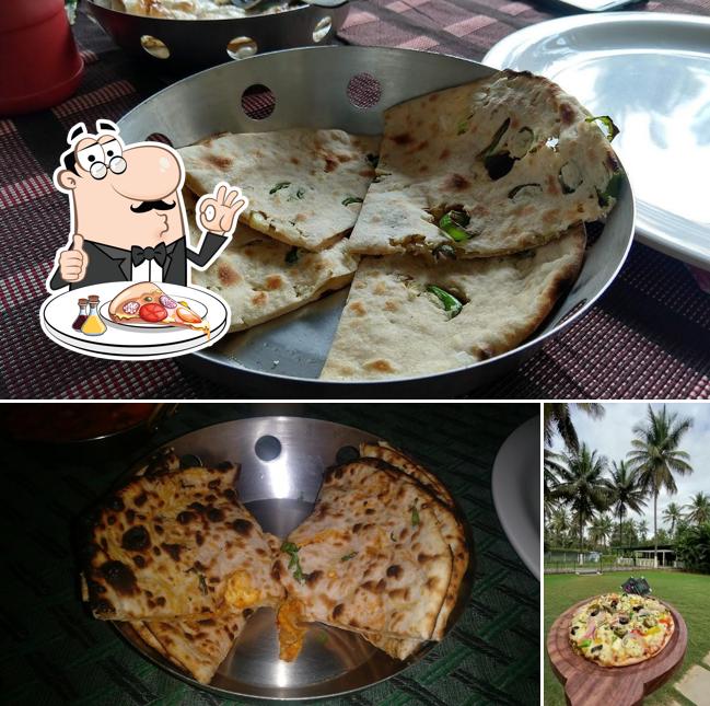 Try out pizza at Coco Grove Restaurant