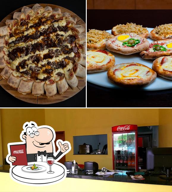 Entre diferentes coisas, comida e interior podem ser encontrados a Domínio Pizzas Ji Parana