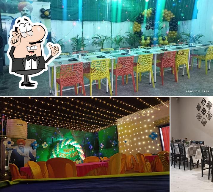 Take a seat at one of the tables at PUNJABI JUNCTION DHABA ( Restaurant)