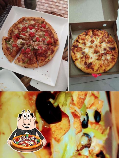 Try out pizza at Sandwich and Shakes