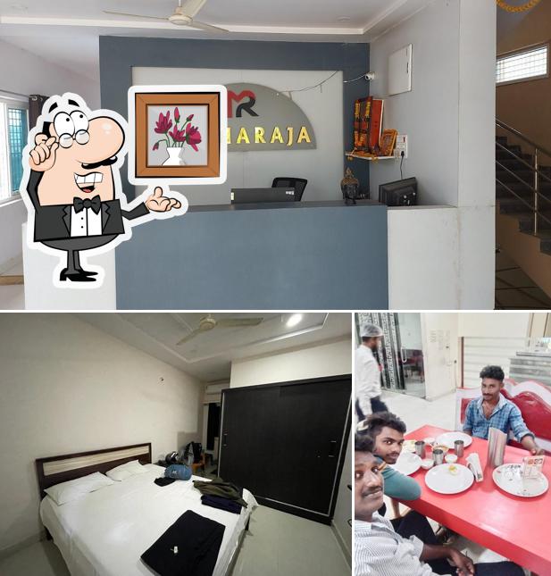 Take a seat at one of the tables at NEW PARADAISE RESTAURANT AND LODGE