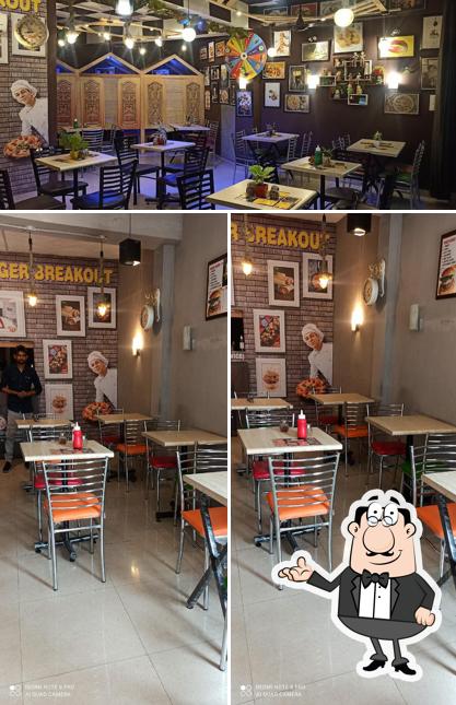 Take a seat at one of the tables at Kalyan's Hunger Breakout