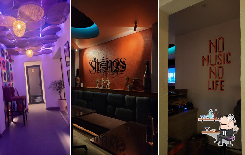 Take a seat at one of the tables at Strings-Cocktail Lounge