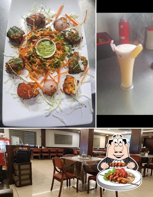 This is the photo depicting food and interior at Shree Atithi Veg Restaurant NX, Mahakaleshwar Mandir (AC Dining Hall)