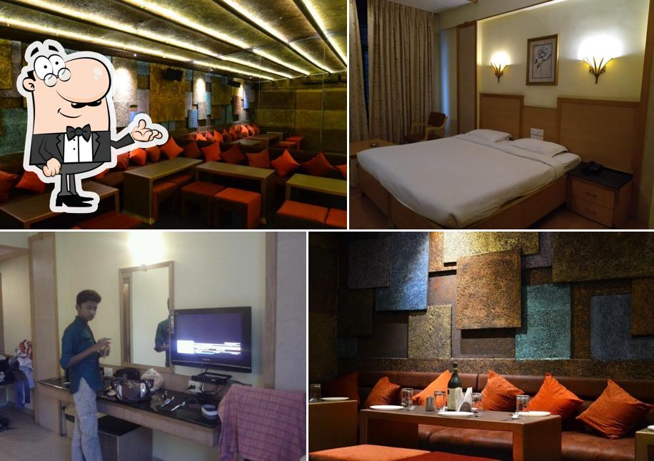 Take a seat at one of the tables at Hotel Roopa