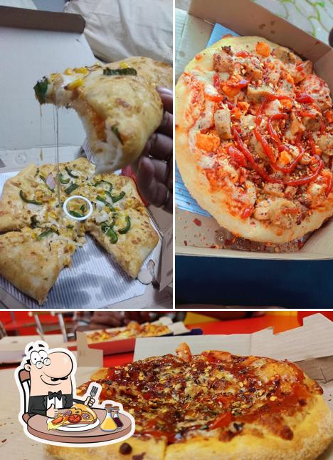 Get pizza at Domino's Pizza Jawahar Nagar, Ujjain