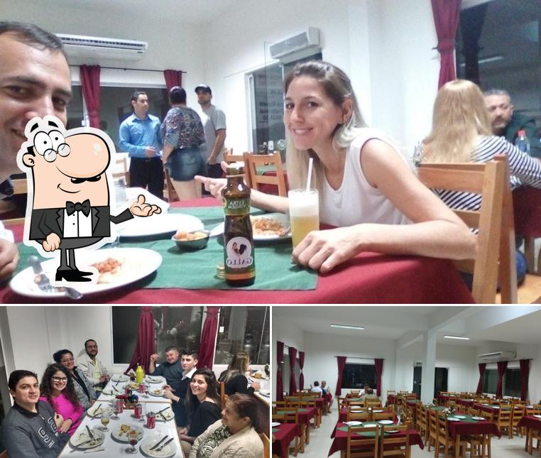 Sente em uma das mesas no Roda Pizza Araldi Pizzaria Rodízio