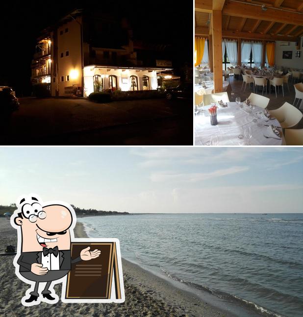 La immagine della esterno e tavolo da pranzo di Ristorante L’Onda