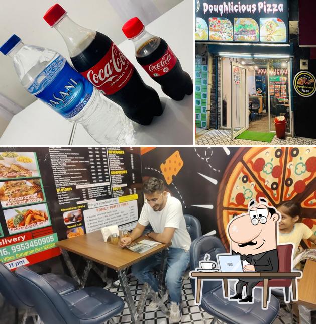 This is the picture displaying interior and beverage at DOUGHLICIOUS PIZZA