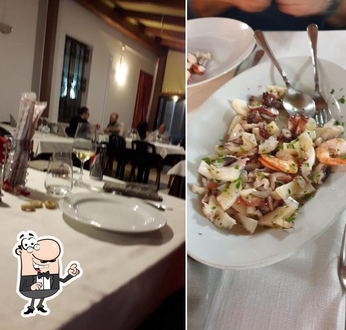 Siediti a un tavolo di Ristorante Il Cartoccio