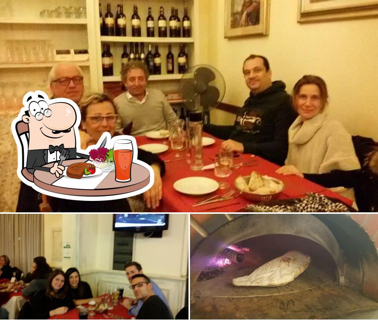 Guarda la immagine che raffigura la tavolo da pranzo e cibo di Mr. Ugo Pizzeria Vesuvio2