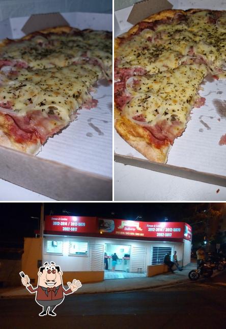 Entre diversos coisas, comida e interior podem ser encontrados a Vila Da Pizza La Massita