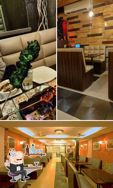 Take a seat at one of the tables at Utsav - The Barbeque Restaurant