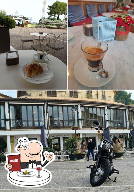 Dai un’occhiata alla foto che presenta la cibo e esterno di Bar Cocktails and Sunset