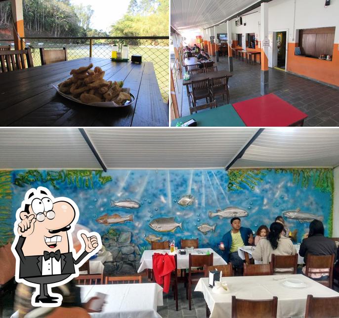 Sente em uma das mesas no Pesqueiro Pingolandia